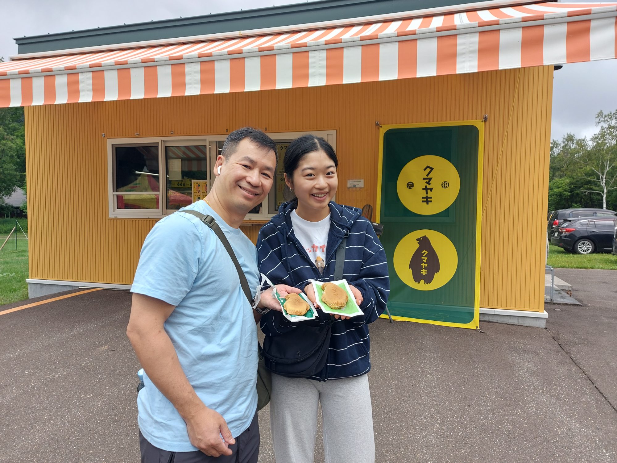 Enjoying some roadside kamayakis - red bean and tapioca, and red bean with whipped cream